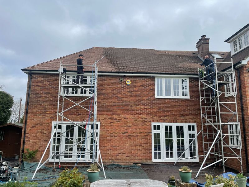 Roof cleaning carried out safely from scaffold towers by The Roof Moss Cleaners in Chatteris